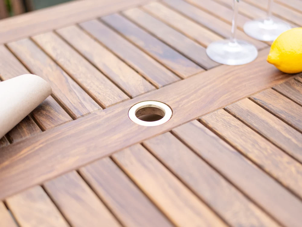 Alexander Rose Dark Acacia Bolney Dining Table Close up shot of the parasol ring Luxury Hardwood Garden Furniture