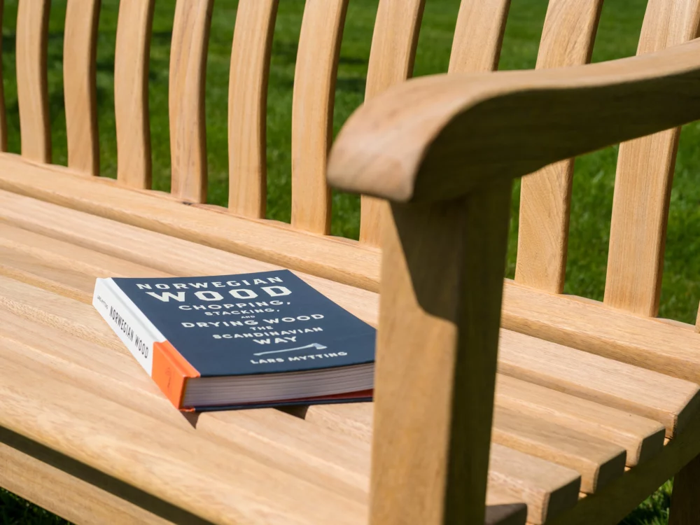 Alexander Rose Broadfield 5ft Roble Bench Close up of Bench with Book Sat on it High Quality Hardwood Bench