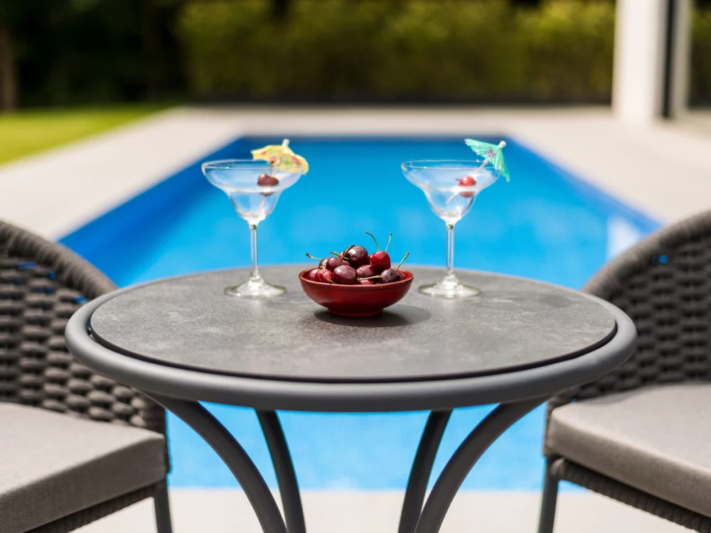 Alexander Rose Dark Grey Cordial Dining Chairs and Cordial Bistro Table Close up Shot Luxury Aluminium Garden Furniture