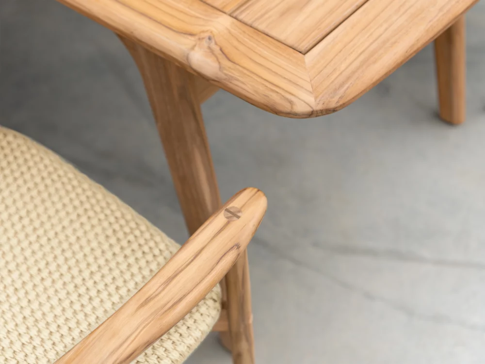 Detail Shot of The Dana Armchair and Dining table Alexander Rose Dana Rectangular Dining Set 1 Teak Dining Chair and Table Mid Century Danish Inspired Outdoor Furniture