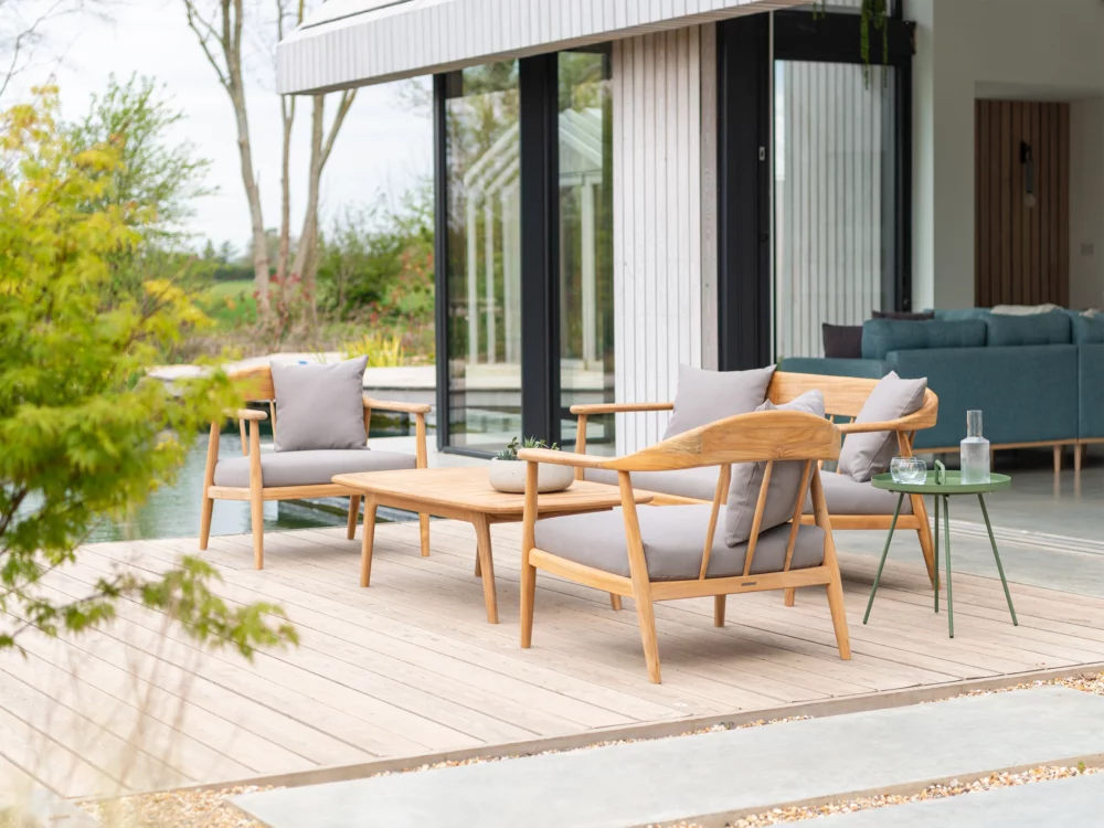 Award winning Alexander Rose Dana Lounge Set Teak Sofa, Two Teak Lounge Chairs and a Teak Coffee Table Mid Century Danish Inspired Outdoor Lounge Set